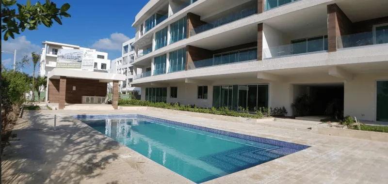 Punta Cana Village modern two-bedroom condo for sale is approximately a five-minute drive from the beach — photo 1